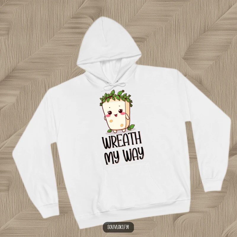 Funny feta cheese character comically trying to wear a tiny laurel wreath, depicted on a cozy hoodie.